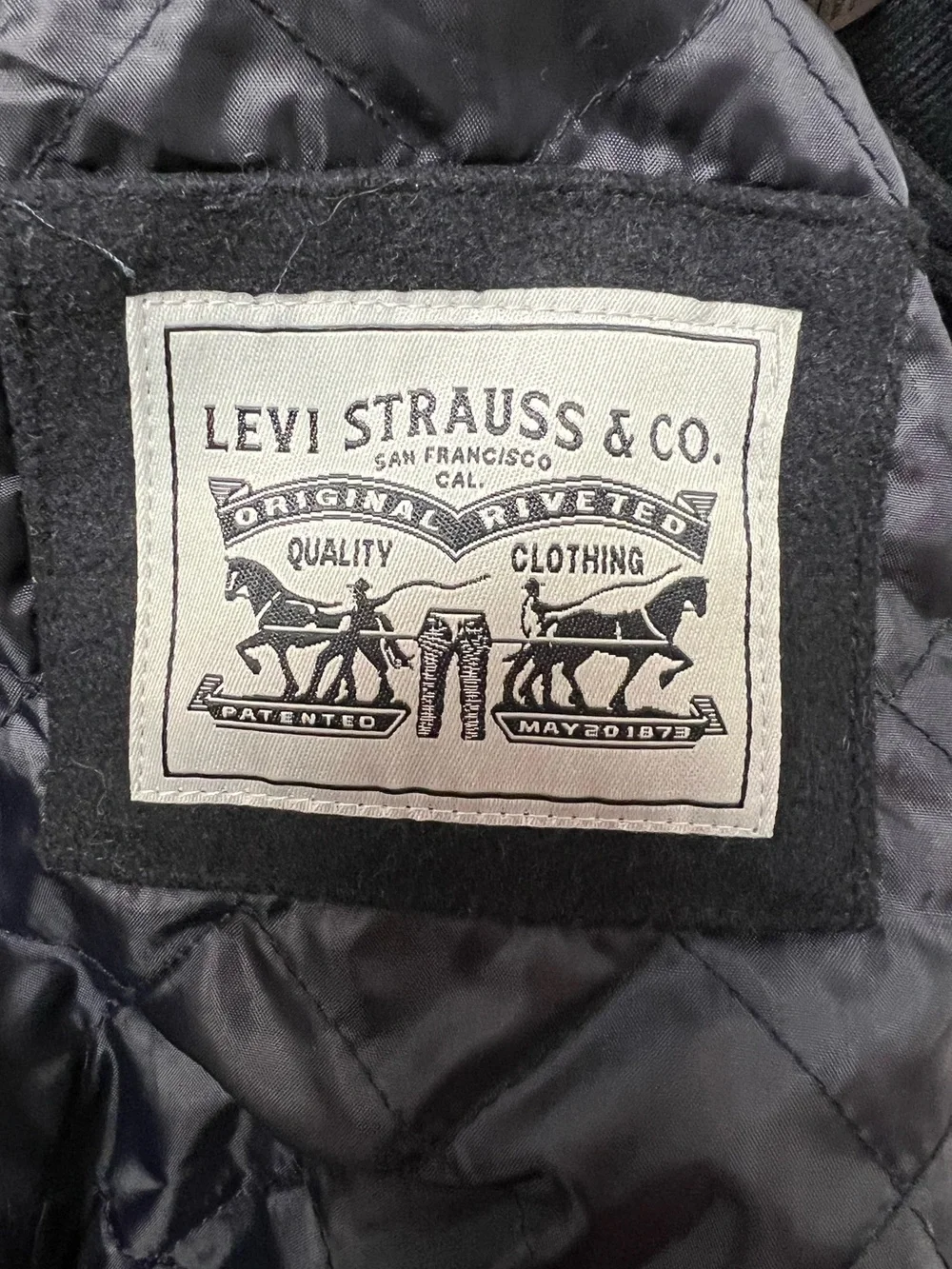 Levi Strauss & Co. Black and White Varsity Jacket with Vegan Leather Sleeves